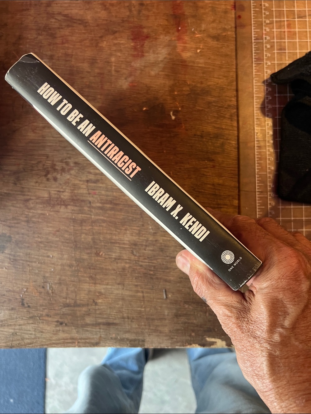 ONE WORLD Hardcover Book - Black and Orange Spine